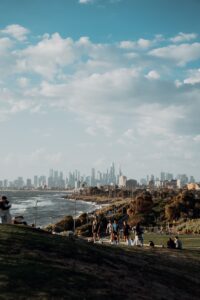 Enjoy a beautiful day at Elwood Beach with a stunning view of Melbourne's skyline in the background.